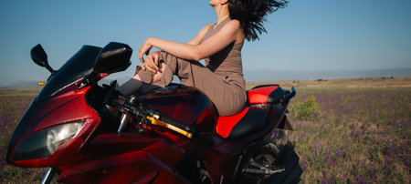girl taking pictures on a motorcycle