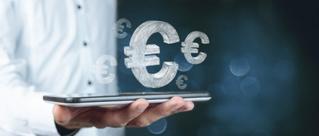 hand holding smartphone with euro symbol coming out of the money, business conceptの写真素材
