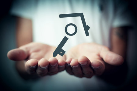 man holds key in palm