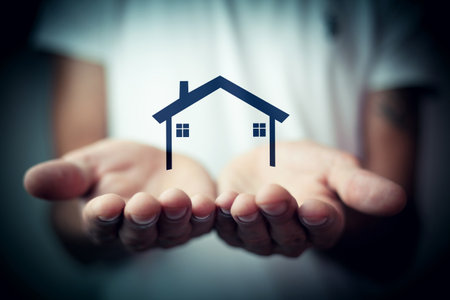 concept of the house. the man holding the houseの写真素材
