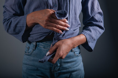 girl puts on a shirtの写真素材