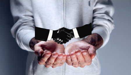 concept of cooperation. handshake and business people