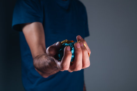 a man holds paper in his hand
