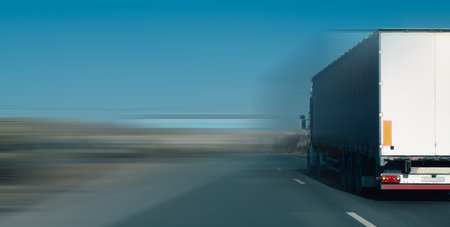 delivery truck driving on highway with motion blur.の写真素材