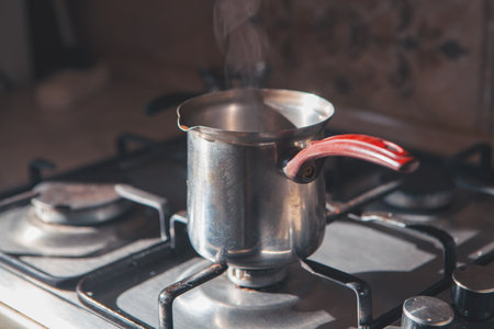 a closeup shot of a cup of hot coffee in the ovenの写真素材