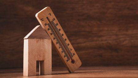 small house with thermometer on tableの写真素材