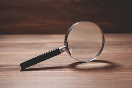 magnifying glass with wood tableの写真素材