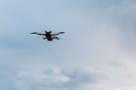 flying in cloudy blue sky drone, copy space.の写真素材