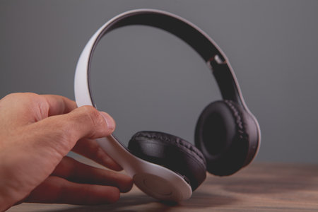 a man holds an earphone in his hand