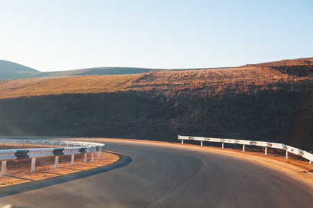 beautiful mountain road at sunsetの写真素材