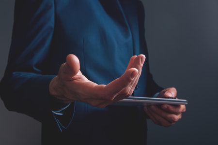 businessman using mobile tablet computer in officeの写真素材