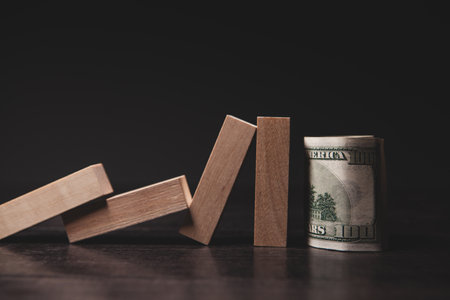 stack of dollars and a wooden signの写真素材