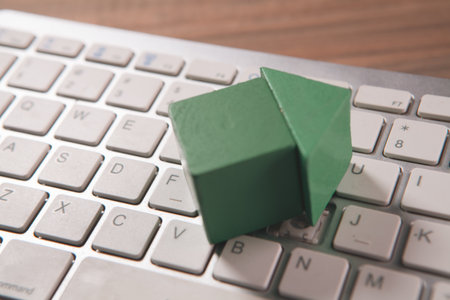 green house keyboard on the table, concept of buying house or real estate