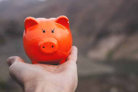 woman hand holding piggy bankの写真素材
