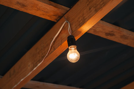 old light bulb on wooden ceiling.