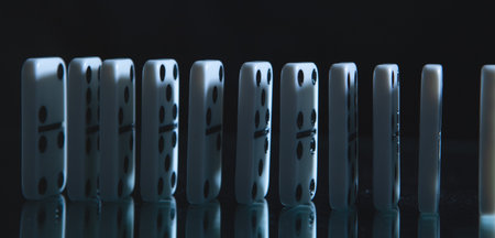 close up of a row of dominoes on a black backgroundの写真素材