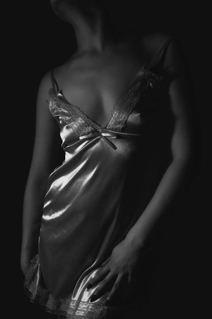 woman with a silk dress in the roomの写真素材