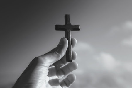 cross on the hand of the man.
