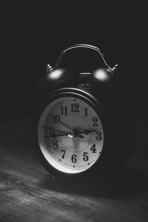 alarm clock on the black table