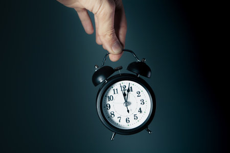 hand holding a black watch.の写真素材