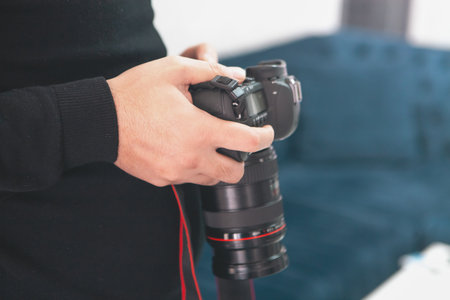 professional photographer with camera in studio