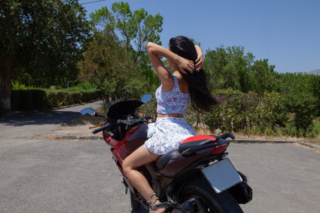 girl posing with motorcycleの写真素材