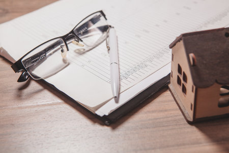 house and documents on the tableの写真素材