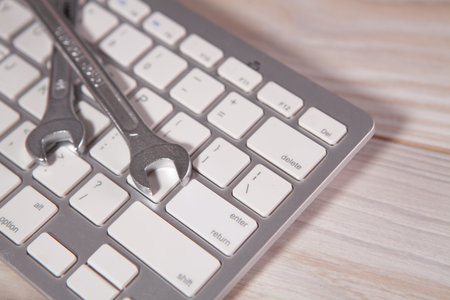 computer keyboard and mouse on white wooden desk backgroundの写真素材