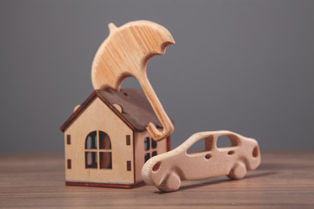 wooden toy house on a wooden tableの写真素材