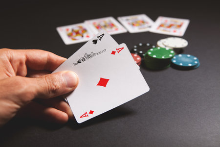 Playing cards and chips on a black background. Casino gambling concept.