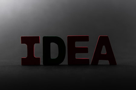 The word idea is made of letters on a dark background.の写真素材