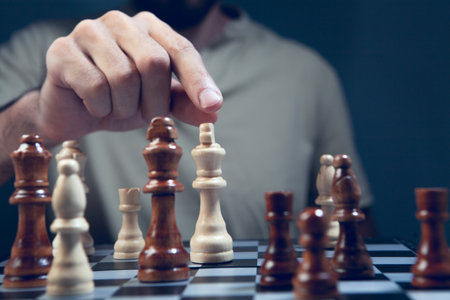 Close up of man playing chess, selective focus, shallow depth of fieldの写真素材