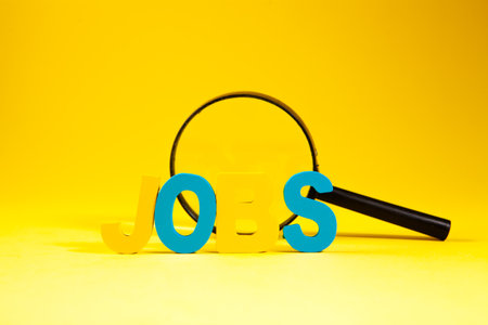 the word s'o' and the blue plastic bottle with a yellow backgroundの写真素材