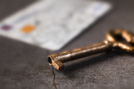 Key on the table, shallow depth of field.