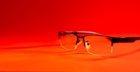 Glasses on a red background. Glasses on a red background.の写真素材