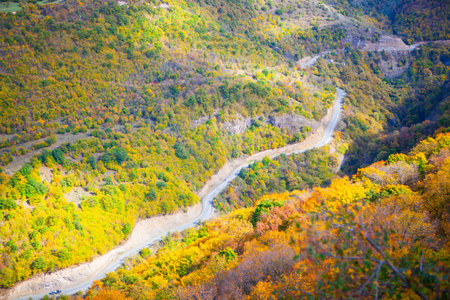 Autumn mountain landscape with colorful forest and winding road. Colorful autumn treesの写真素材