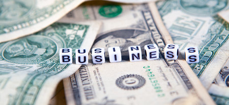 The word business on the background of dollar bills. Business concept.の写真素材