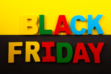 Black Friday. The inscription in multicolored letters on a black background.の写真素材