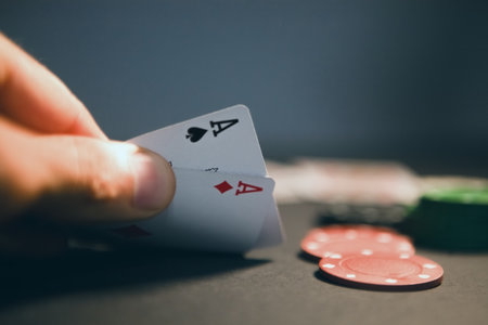 Playing cards and chips on a dark background. Close-up.
