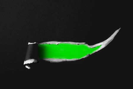 Torn paper with space for your message on black background, top viewの写真素材