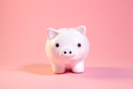 Piggy bank on pink background. The concept of saving money.の写真素材