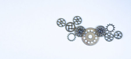 Silver gears and cogwheels on white background. Top view.の写真素材