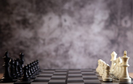 Chess board with chess pieces on it. Blurred background.
