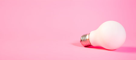 Wooden blocks and light bulb on a yellow background. Business conceptの写真素材