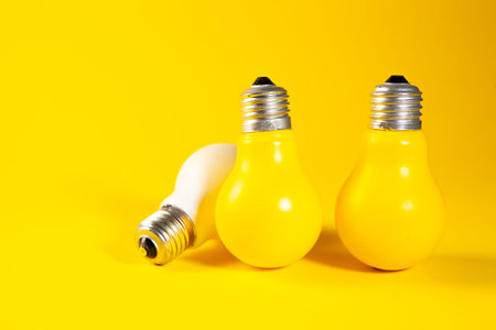 yellow light bulb with a white background