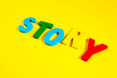 Wooden letters spelling the word on a yellow background.