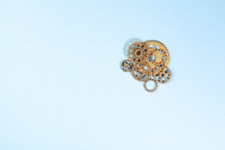 Gears and cogwheels on a blue background, top view