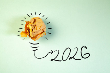 New Year 2026 concept with crumpled paper ball and lightbulb