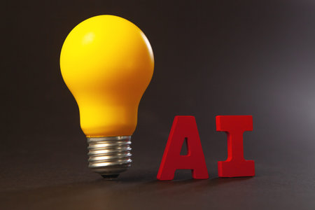 Yellow lightbulb with the word AI on a dark background.