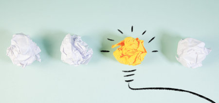 Conceptual image of crumpled paper and lightbulb